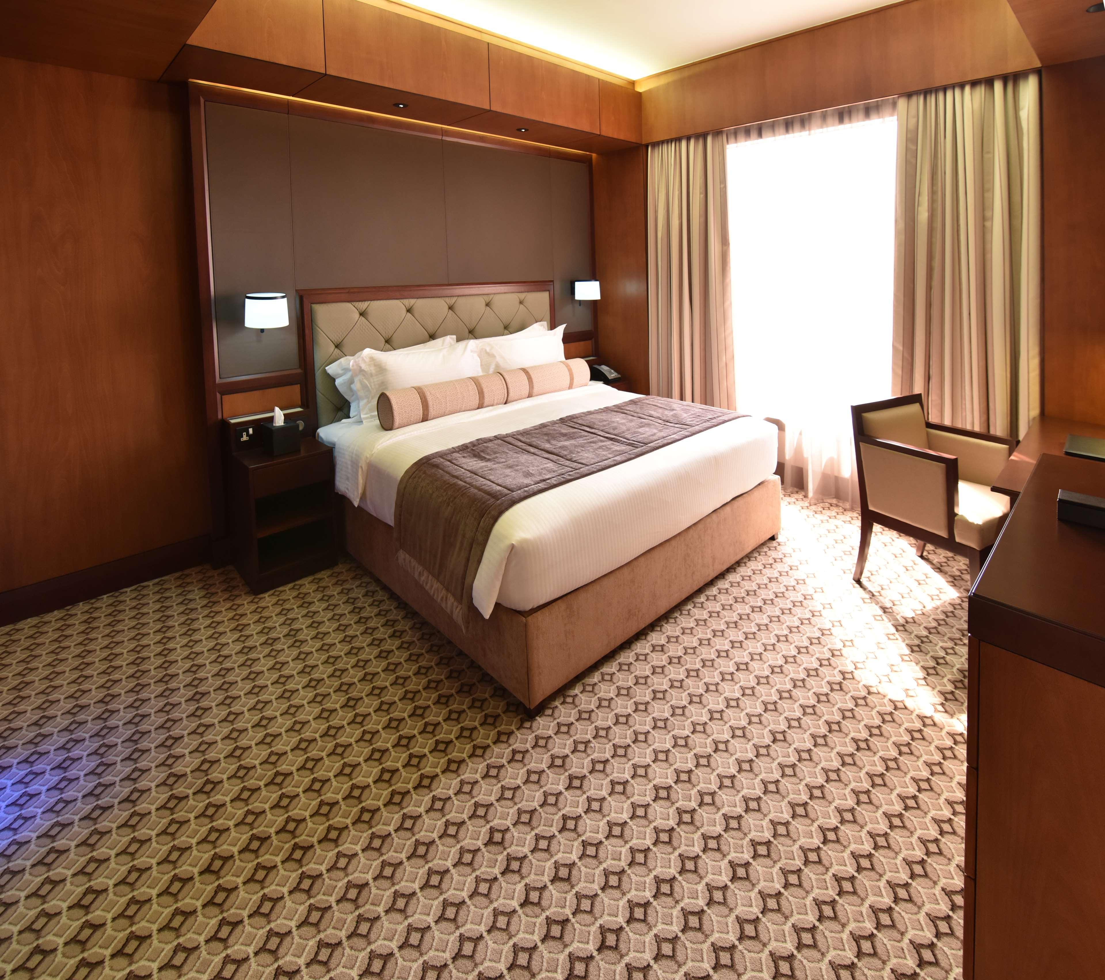 艾拉格兰德酒店 艾因 外观 照片 A bedroom in the hotel